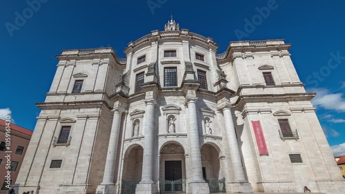 Entrance and main facade of National Pantheon aerial timelapse hyperlapse (The Church of Santa Engracia), a 17th-century monument in downtown Lisbon. Clouds on a blue sky. Portugal. photo