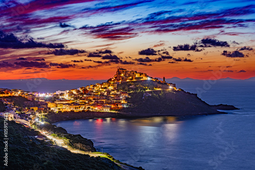 Fototapeta Naklejka Na Ścianę i Meble -  Dramatic sunset over the medieval town of Castelsardo, Province of Sassari, Sardinia, Italy, Europe.