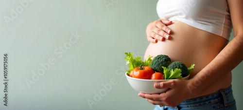 Pregnant woman with bowl of fresh vegetables. Prevention of anemia. Healthy nutrition, balanced diet during pregnancy. Prenatal care concept, weight control, 