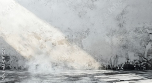 Soft sunlight illuminates a foggy interior space with textured walls in a ser...