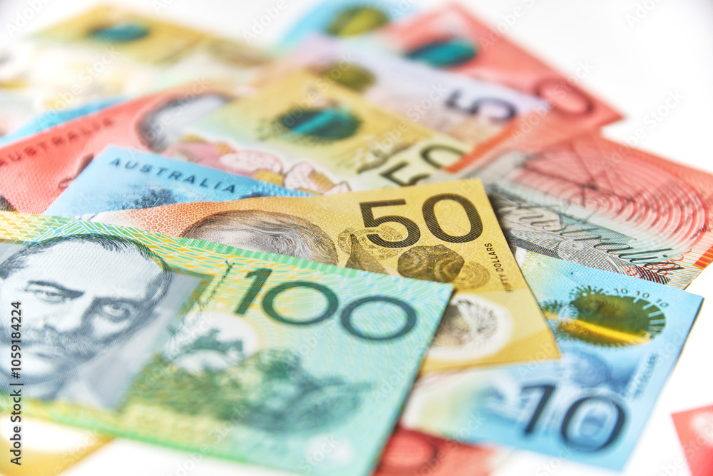 Collection of Australian banknotes scattered on a flat surface Collection of Australian banknotes scattered on a flat surface