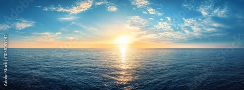 Golden sunset over calm ocean waves creates a serene atmosphere at twilight