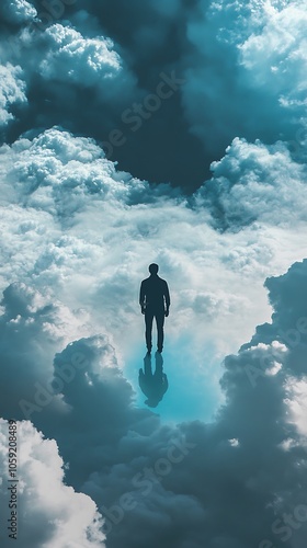 Silhouette of a Man Standing on a Sea of Clouds