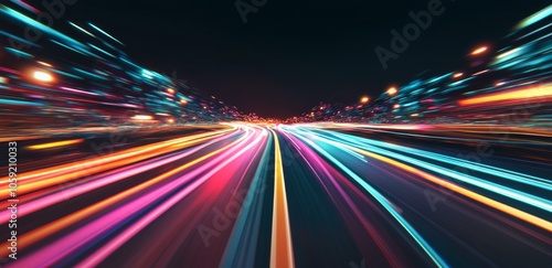 Vibrant light trails create a sense of motion in a nighttime urban landscape ...