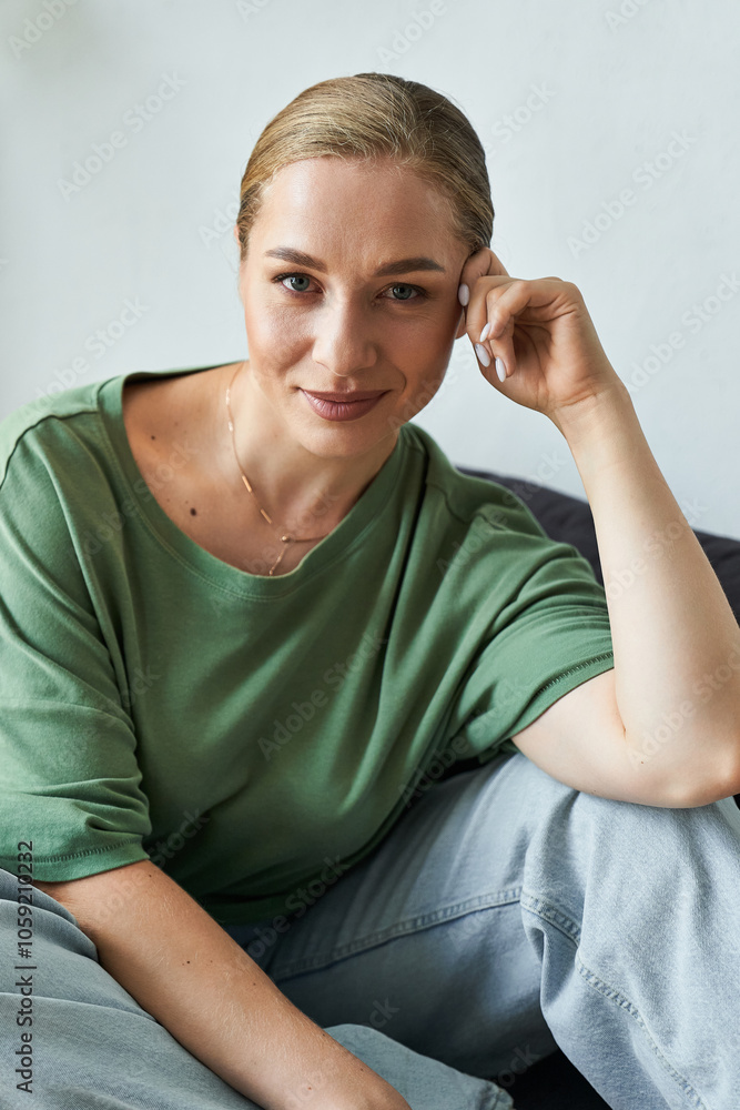 A joyful young plus size woman relaxes at home during her leisure time. A joyful young plus size woman relaxes at home during her leisure time.