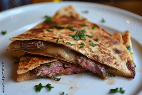 Classic steak quesadilla on a white dish