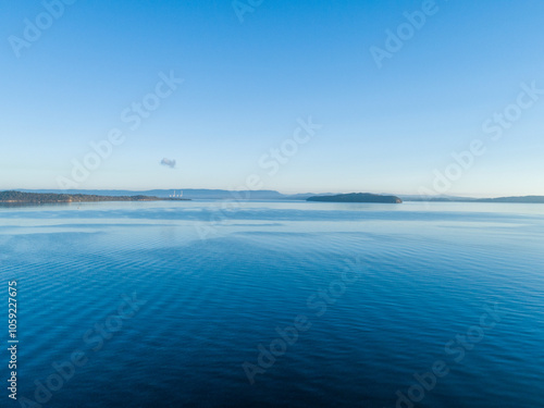 Aerial landscape view over blue water of lake Macquarie on calm morning