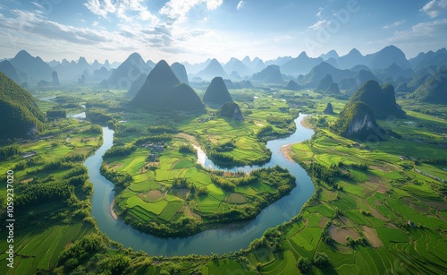 Stunning aerial view of winding river through lush green rice terraces