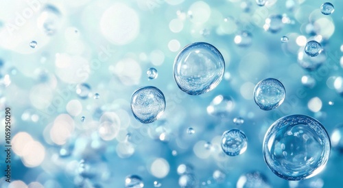Translucent water droplets create a serene background with shimmering highlig...