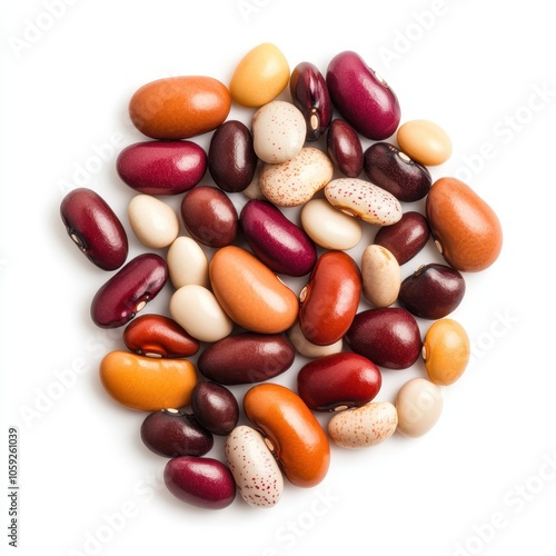 A colorful assortment of various beans scattered against a white background, showcasing their different shapes and colors.