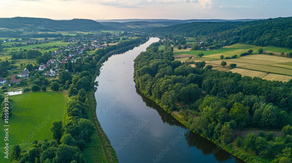 aerial view of a river winding through lush green countryside aerial view of a river winding through lush green countryside