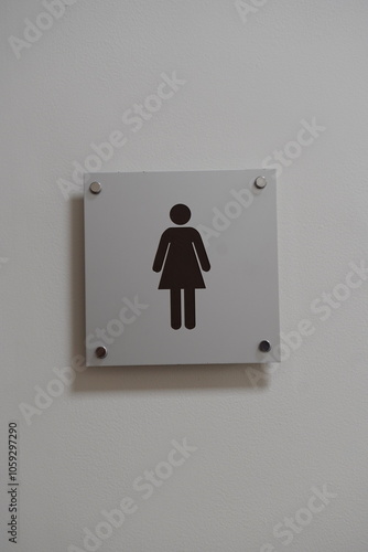 modern public toilet sign on the cement wall