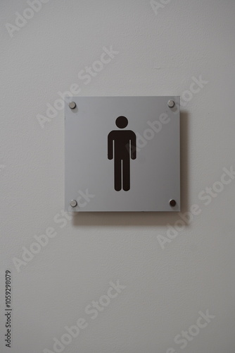 modern public toilet sign on the cement wall