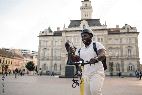 Delivery man using smartphone app for navigation while riding e scooter