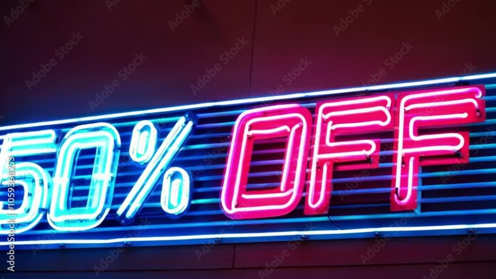 A neon 50% OFF sign in alternating flashes of blue and pink, creating a dynamic visual against a sleek dark wall. A neon 50% OFF sign in alternating flashes of blue and pink, creating a dynamic visual against a sleek dark wall.