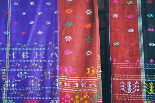 Close up of the colorful traditional woven fabric called Ulos showing the authentic culture and heritage of the Batak indigenous people of Indonesia photo