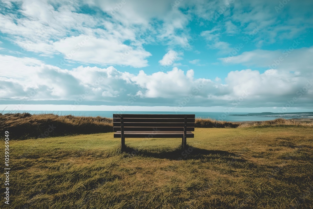 A solitary bench faces a panoramic vista of the ocean, inviting contemplation and reflection. A solitary bench faces a panoramic vista of the ocean, inviting contemplation and reflection.