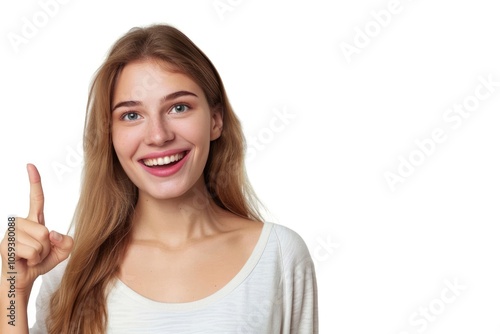 Smiling woman pointing to copy space on white background.