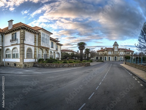 Scenic View of Rianxo, Coastal Town in Galicia, Spain with Lush Greenery and Dramatic Sky Perfect for Travel photo