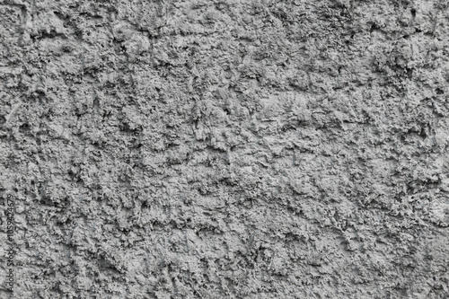 Background, texture of a gray uneven rough wall made of stone, cement.