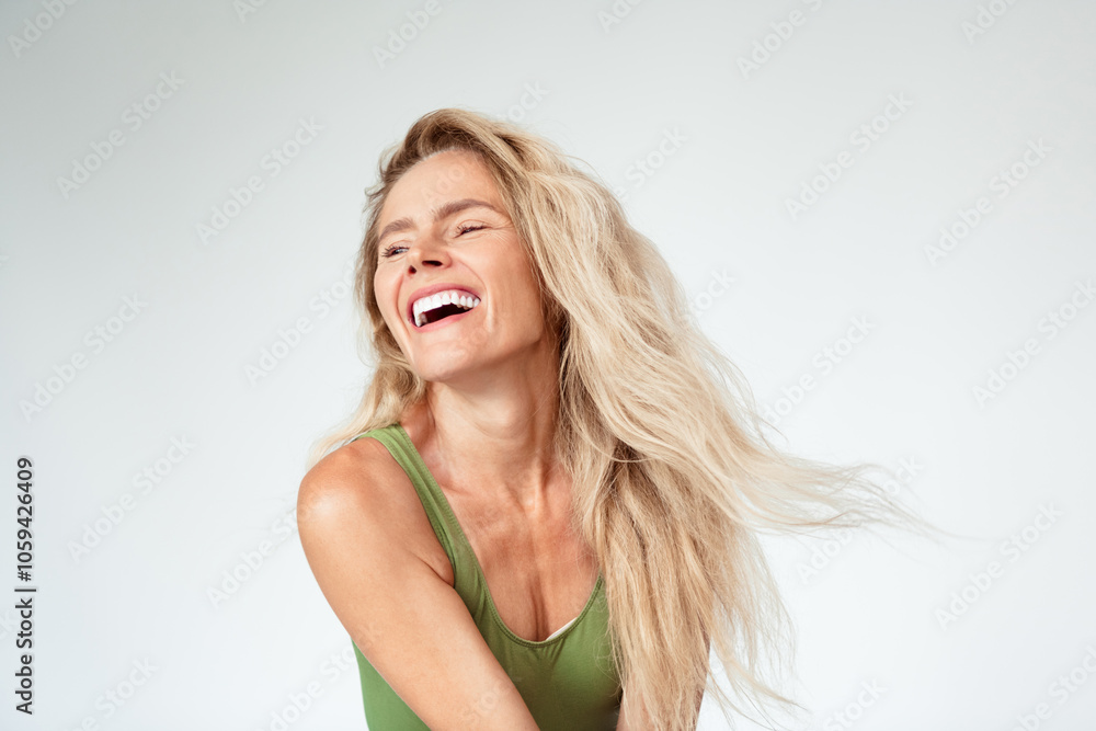 Photo of mature blonde female laugh fluttering hair dressed khaki lingerie white background no filter self acceptance all body perfect Photo of mature blonde female laugh fluttering hair dressed khaki lingerie white background no filter self acceptance all body perfect