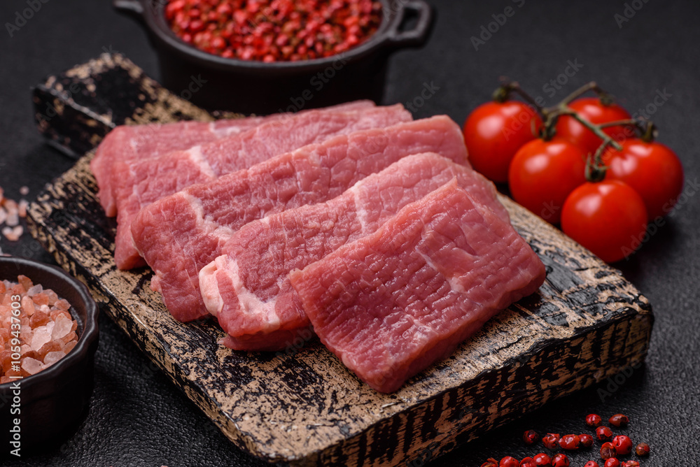 Juicy beef cut into slices with salt, spices and herbs Juicy beef cut into slices with salt, spices and herbs