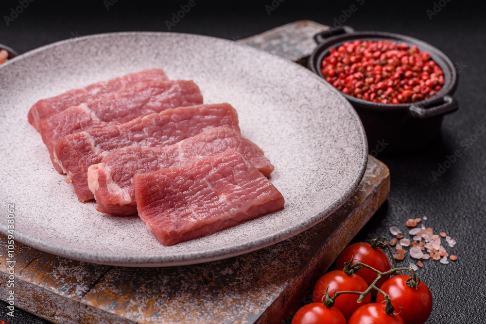 Juicy beef cut into slices with salt, spices and herbs Juicy beef cut into slices with salt, spices and herbs
