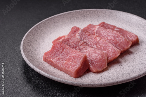 Juicy beef cut into slices with salt, spices and herbs