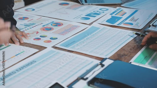 Meeting with financial advisors to analyze production costs and analyze marketing charts in business reports and adjust investment strategies to increase company profits.