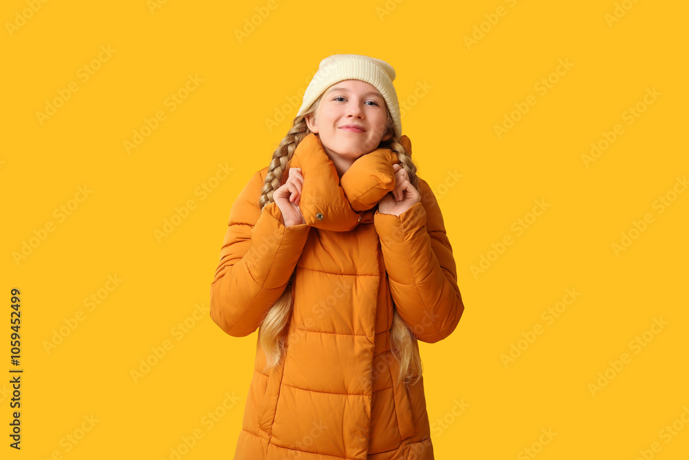Beautiful young happy woman in warm winter clothes on yellow background Beautiful young happy woman in warm winter clothes on yellow background