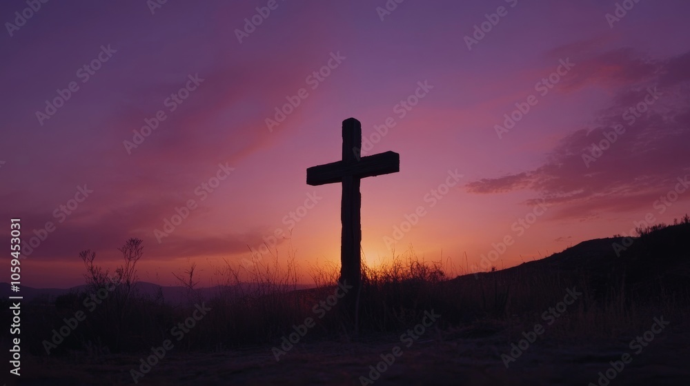 Large wooden cross standing on hilltop at sunset with purple sky Large wooden cross standing on hilltop at sunset with purple sky