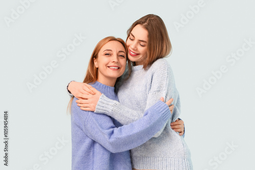 Mature woman hugging her ha...