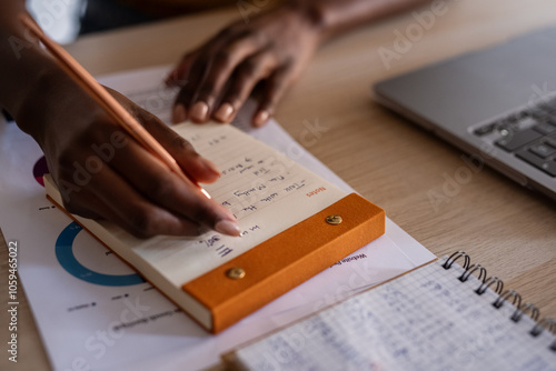 Woman taking notes photo