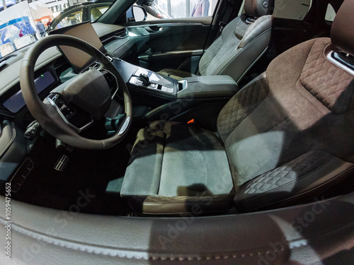 The interior of a car features essential components including a steering wheel and comfortable seats, showcasing elements of automotive design and functionality within the vehicle photo