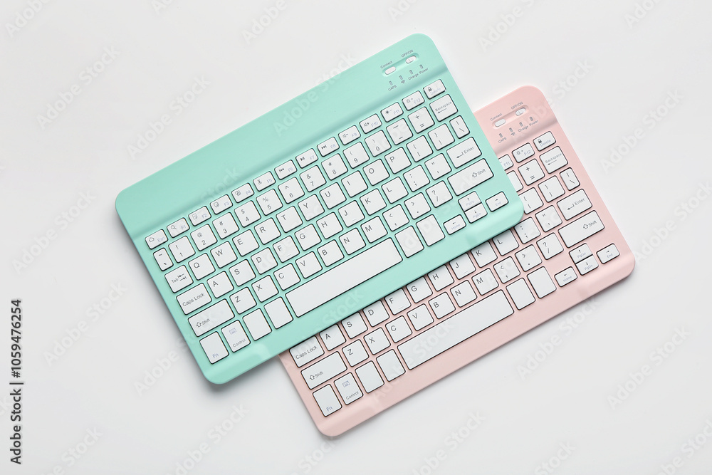 Modern wireless keyboards isolated on white background Modern wireless keyboards isolated on white background