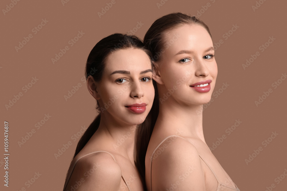 Attractive sisters on brown background Attractive sisters on brown background