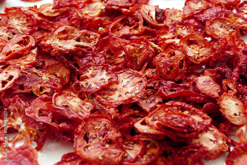 drying tomatoes in the sun, finely chopped tomatoes are dried on the balcony,