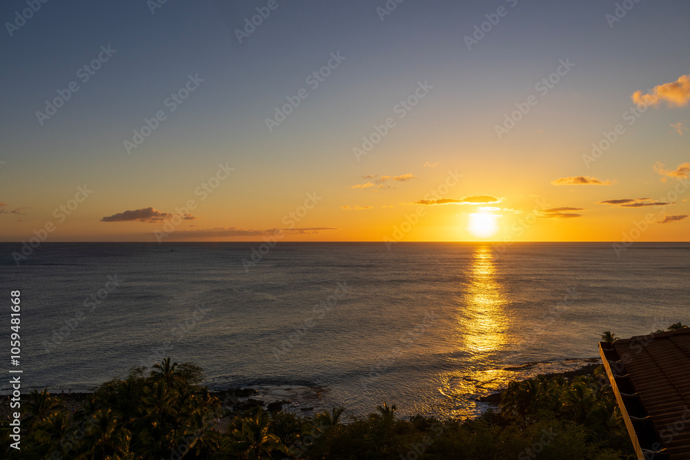 A stunning sunset over the pacific ocean of the coast of the island of Oahu in Honolulu Hawaii USA A stunning sunset over the pacific ocean of the coast of the island of Oahu in Honolulu Hawaii USA