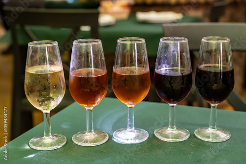 Flight of five sherry wine from barrels, fino, manzanilla, olorosso, amontillado, pedro ximenez jerez wines in old tavern, wine tasting, Sanlucar de Barrameda, Cadiz, Andalusia, Spain