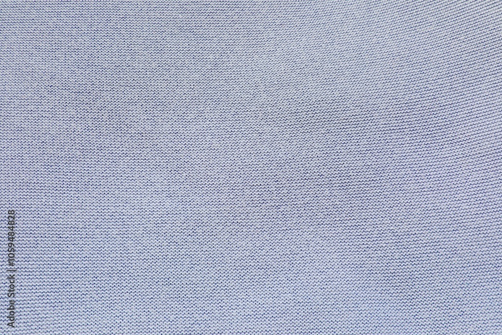 Knitted pure cotton fabric of light blue color. Knit texture. Knitted pure cotton fabric of light blue color. Knit texture.