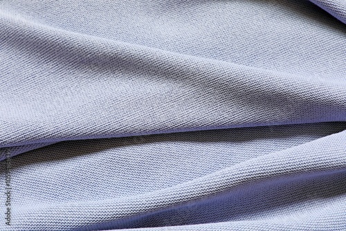 Knitted pure cotton fabric of light blue color. Knit texture.