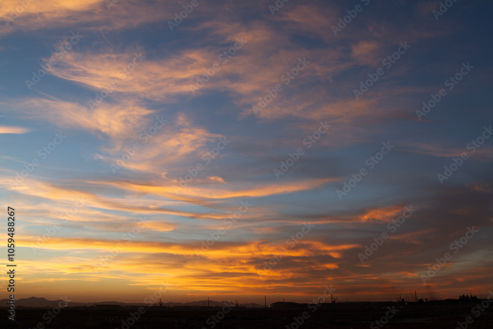 Beautiful , luxury soft gradient orange gold clouds and sunlight on the blue sky perfect for the background Beautiful , luxury soft gradient orange gold clouds and sunlight on the blue sky perfect for the background