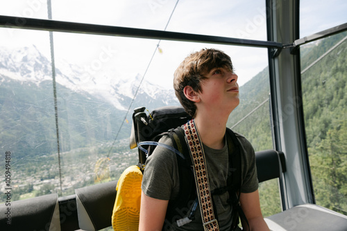 teen sitting in cable car about to hike in the Alps, la Flégère photo