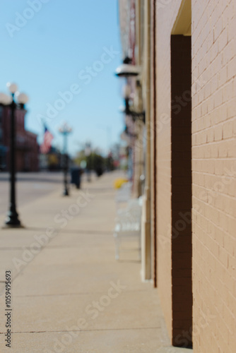 Wallpaper Mural small town life scene with close-up on pavement and brick with blurred background Torontodigital.ca