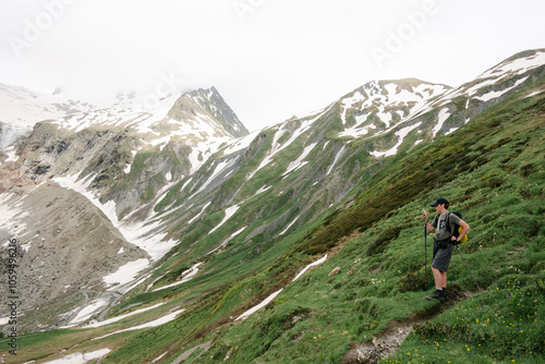 teen boy hiking the Tour du Mont Blanc, in the Alps, grand col Ferret photo