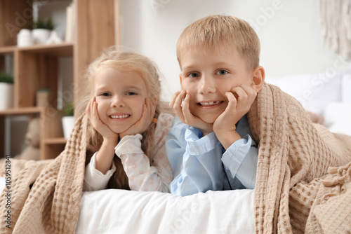 Little kids in pajamas unde...