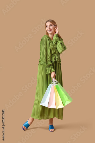 Happy young woman in green ...