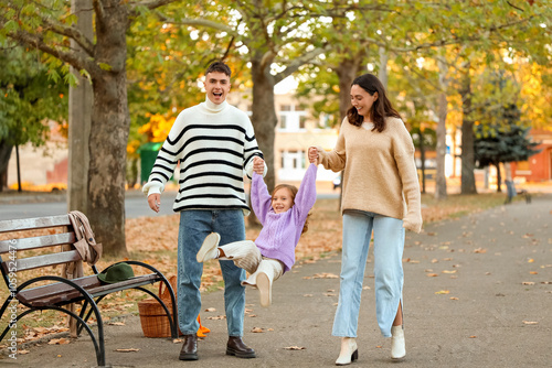 Happy family having fun whi...