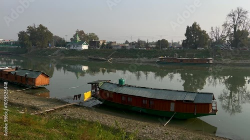 Serene Sunset Over Lake Jhelum: Kashmir’s Evening Beauty with Scenic Bridge and Tranquil Waters Clip 7