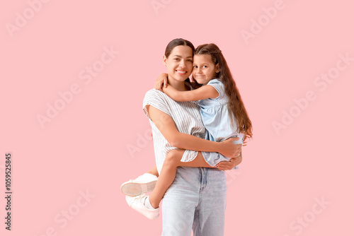 Happy mother holding her li...